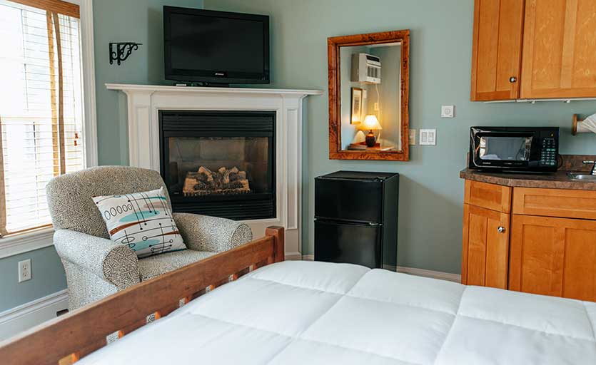 Dorothea Dix room with fireplace and flat screen tv at our Provincetown Lodging