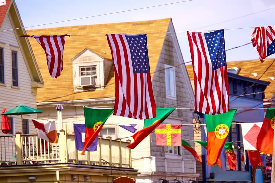 American flags flying above the buildings in Cape Cod Provincetown in Massachusetts USA