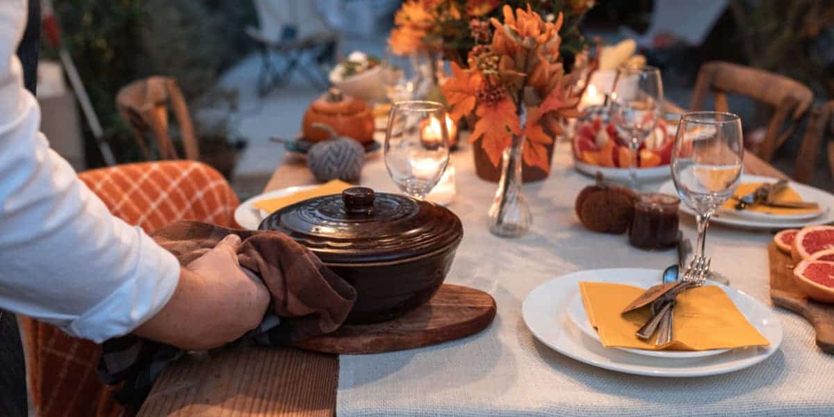 Fall meal being served to table to people