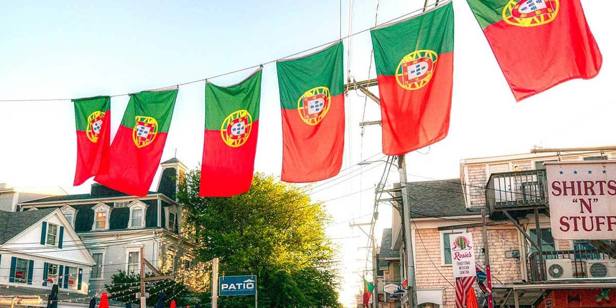 Provincetown Events - Portuguese flags hanging above the road for Portuguese Festival in Provincetown, MA