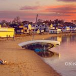 Pet-friendly Provincetown: A person by the beach with their dog