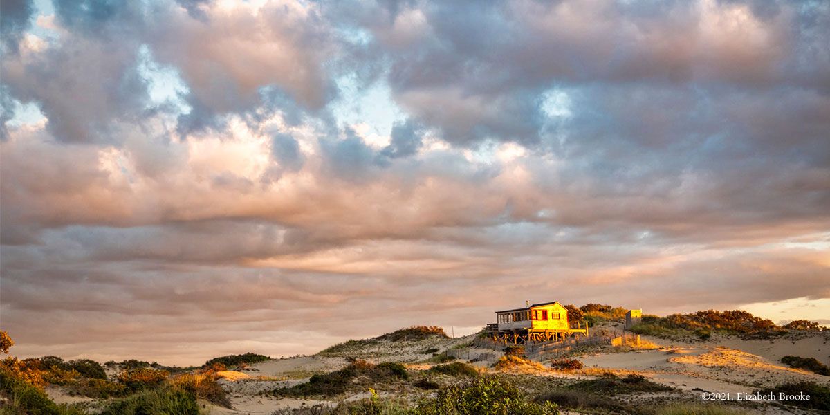 Visiting Cape Cod - A dune shack during sunset