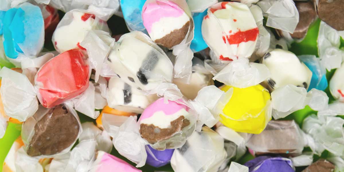 multiple different saltwater taffy in candy wrappers
