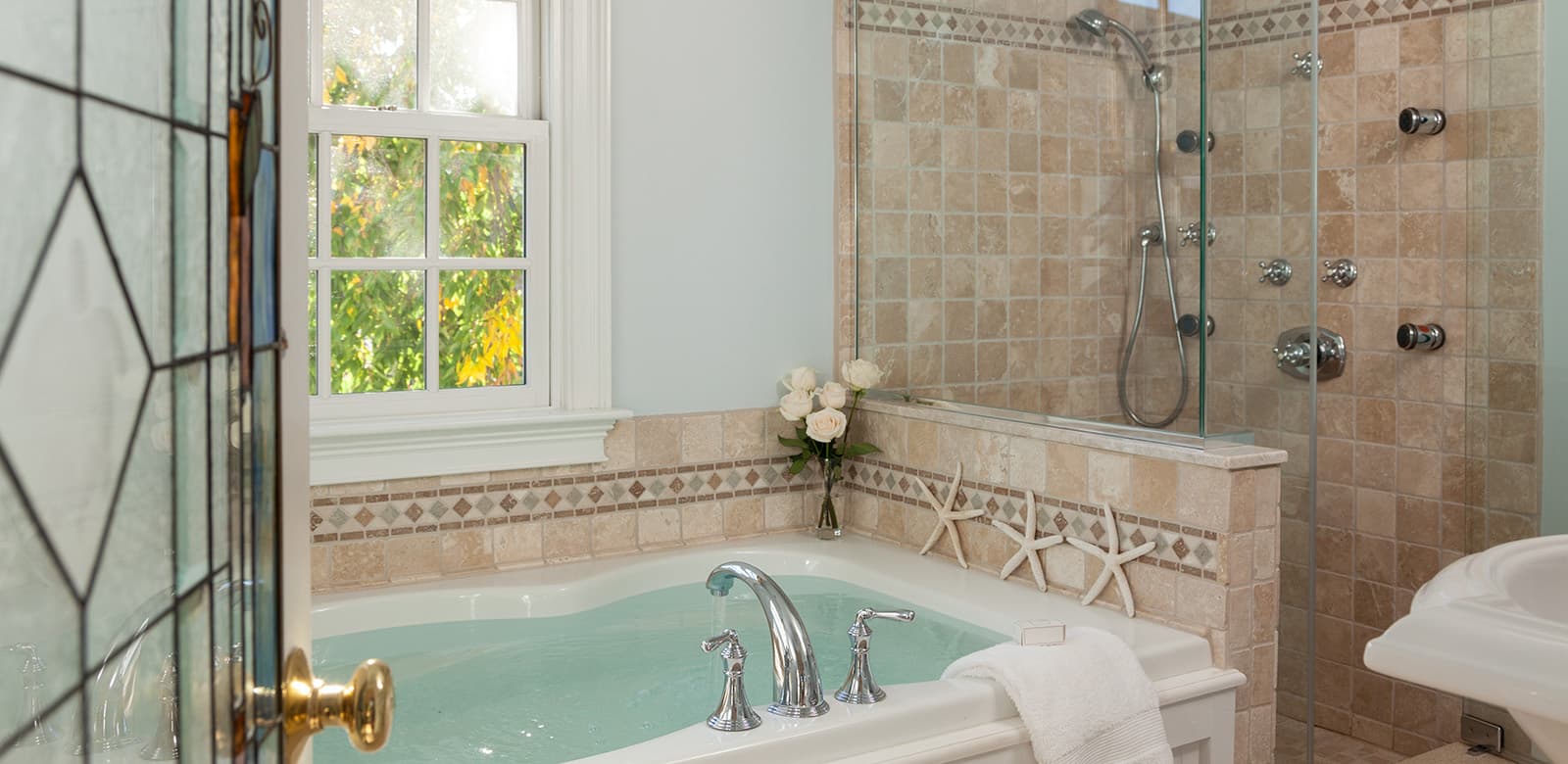 Ariel bathroom with bathtub and walk-in shower