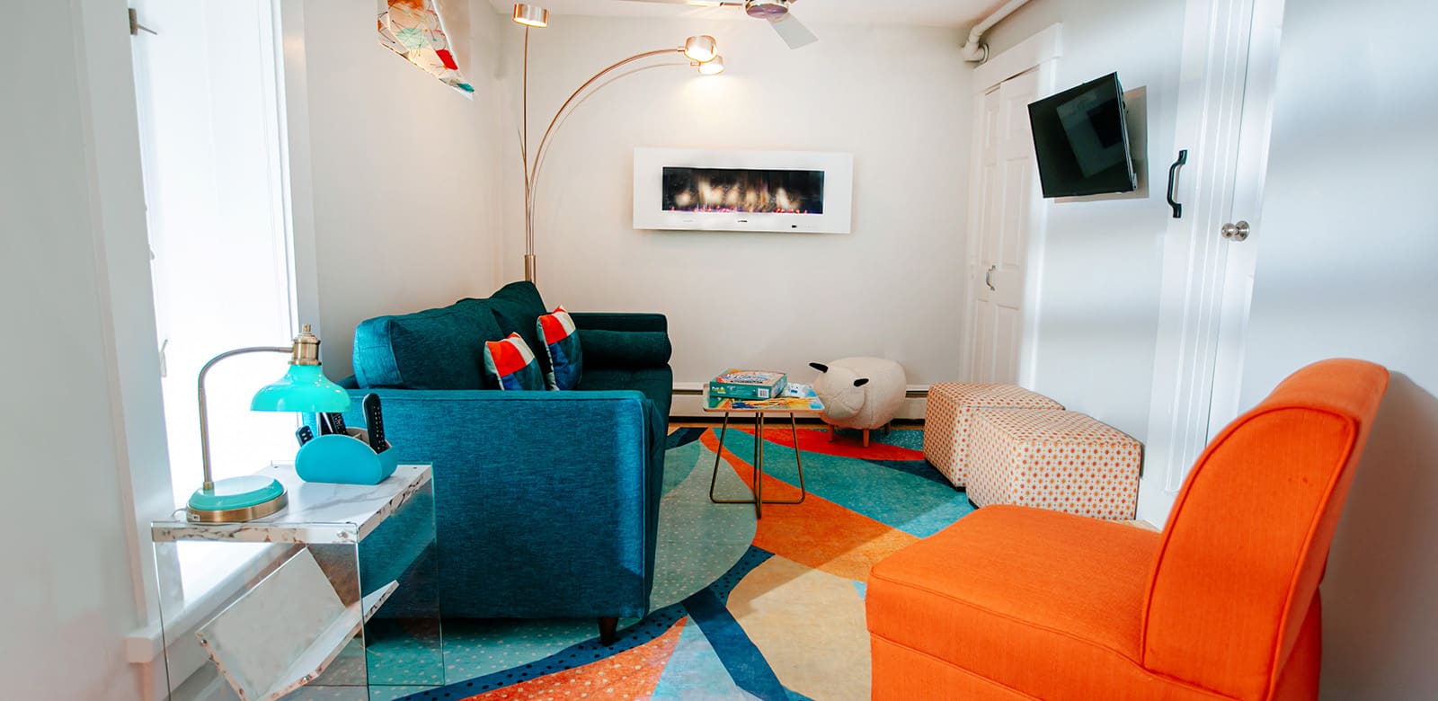 Sitting area at Michael with fireplace and love seats