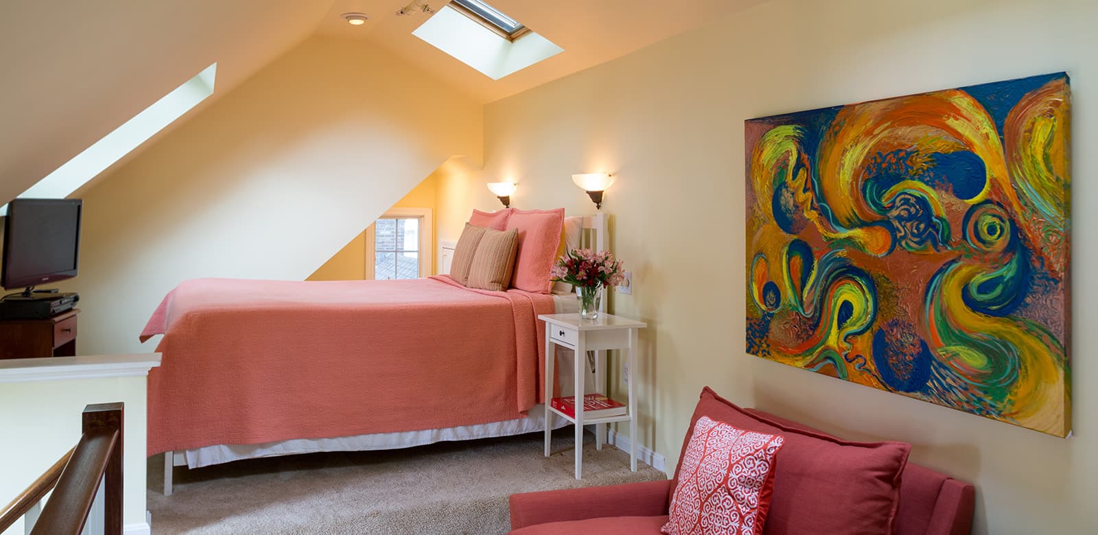 Bed with TV and separate sitting area