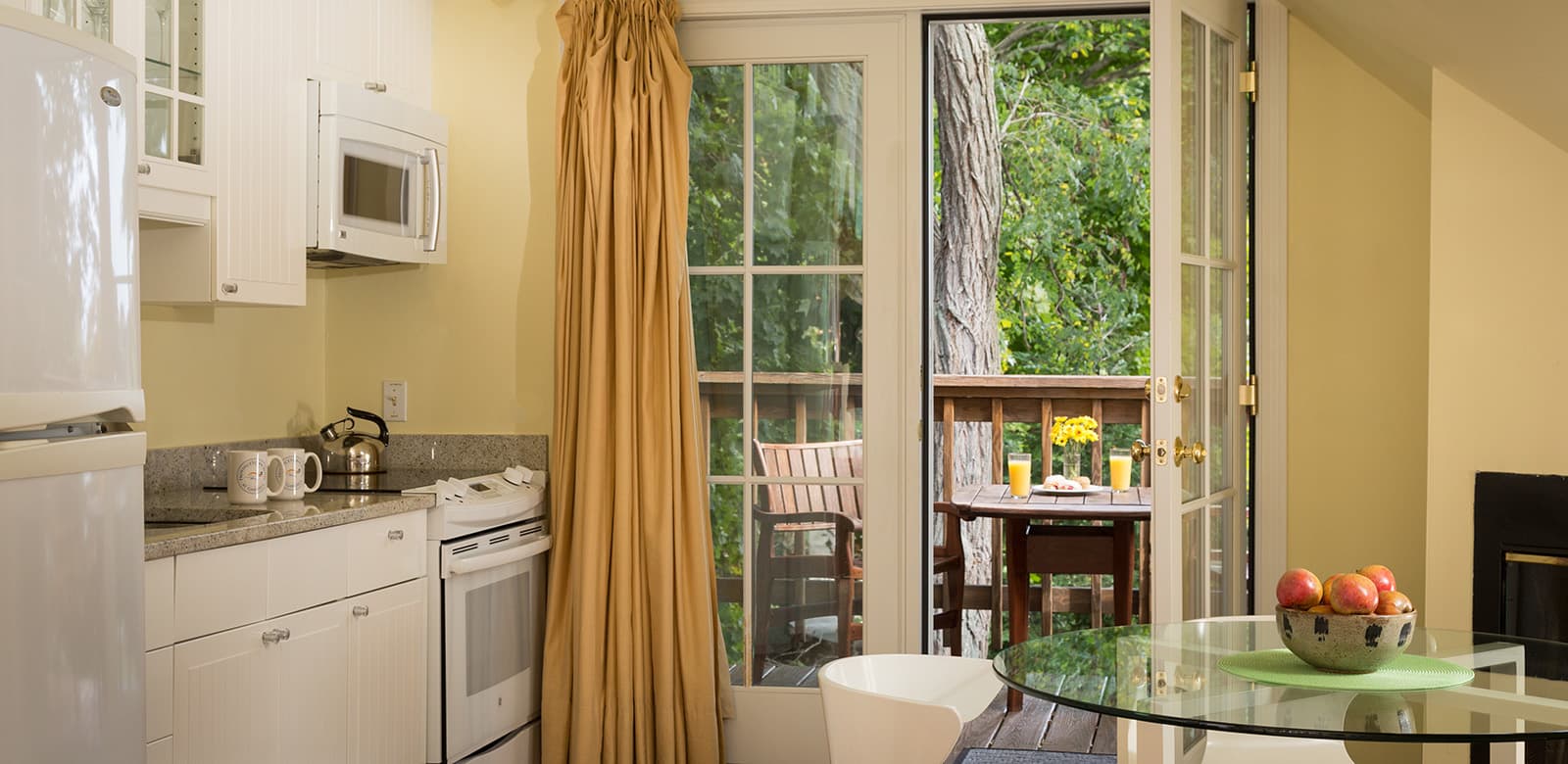 Open Kitchen, dining table, and view to outdoor patio