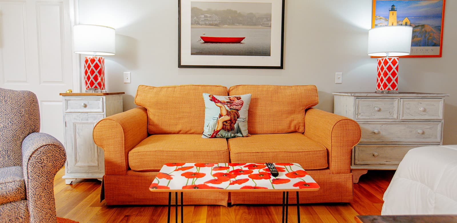 Couch with two lampshades on the side at Susan