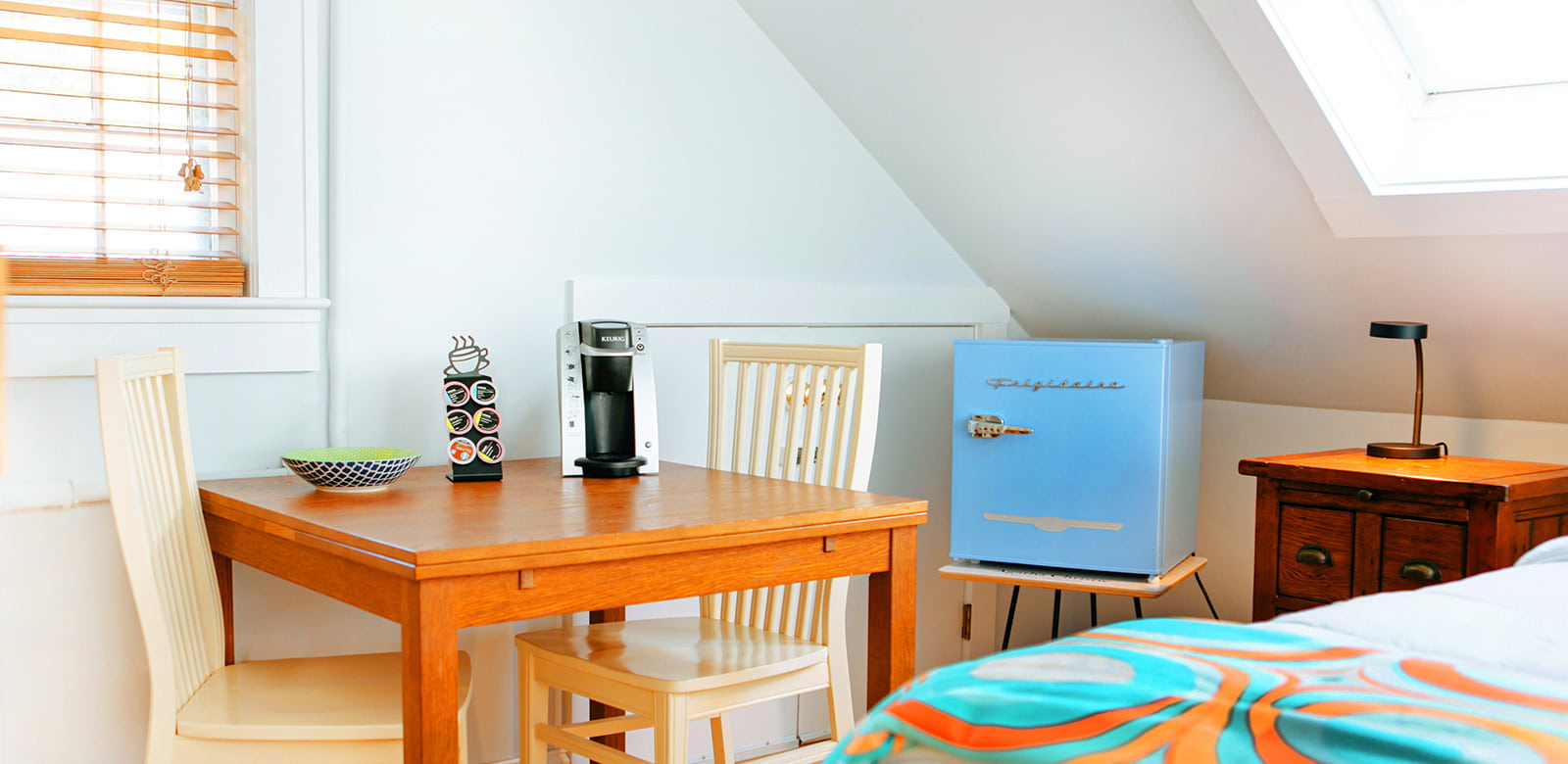 Agatha Christie table and chairs with a mini fridge