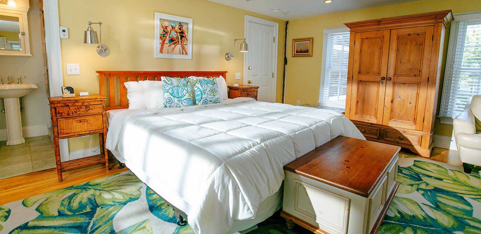 King size bed with a view of the entrance to the bathroom at Willow