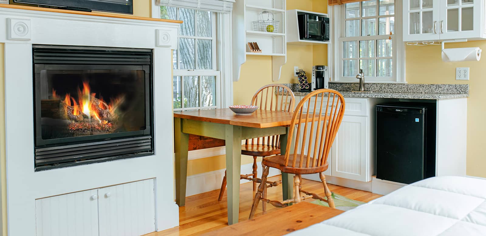 Kitchen with Dining Table and Fireplace