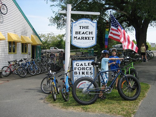Young ones on Bikes in front of The Beach Market